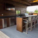 Rooftop deck with outdoor kitchen built by Unique Deck Builders using Deckorators composite decking